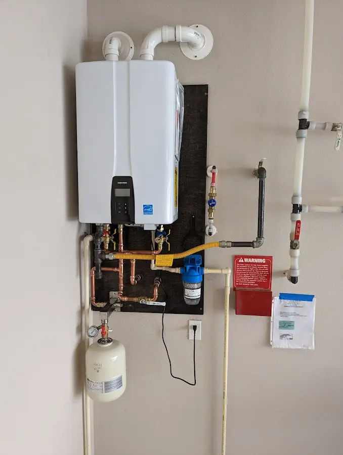 Professional plumber installing copper piping in a Pasadena home